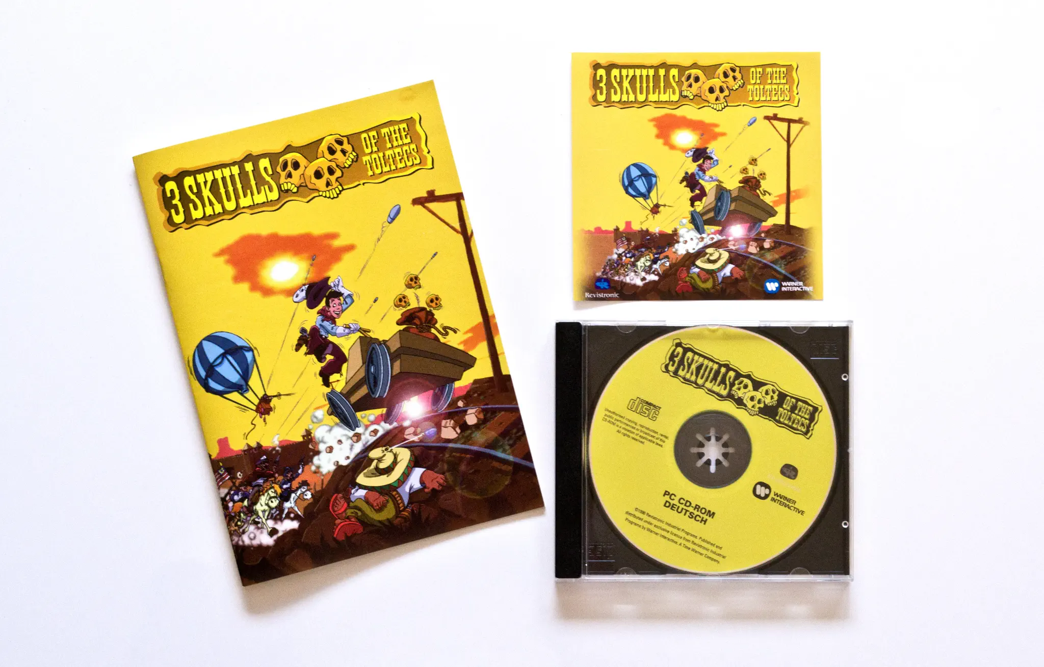Photo of the content of 3 Skulls of the Toltecs (1996, PC, EU); developed by Revistronic, published by Warner Interactive Entertainment Ltd.; Hi-res 3D box available at https://bigboxcollection.com