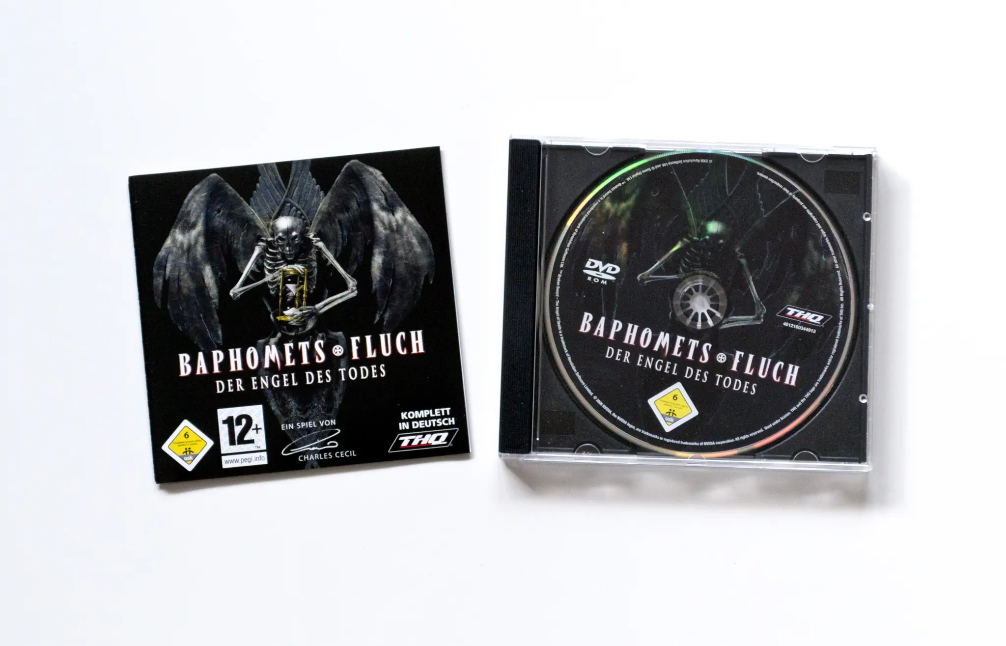 Photo of the content of Broken Sword: The Angel of Death (2007, PC, DE) Photo of the content of Broken Sword: The Angel of Death (2007, PC, DE); developed by Revolution Software Ltd.; Sumo Digital Ltd (Sheffield), published by ak tronic Software & Services GmbH; Hi-res 3D box available at https://bigboxcollection.com