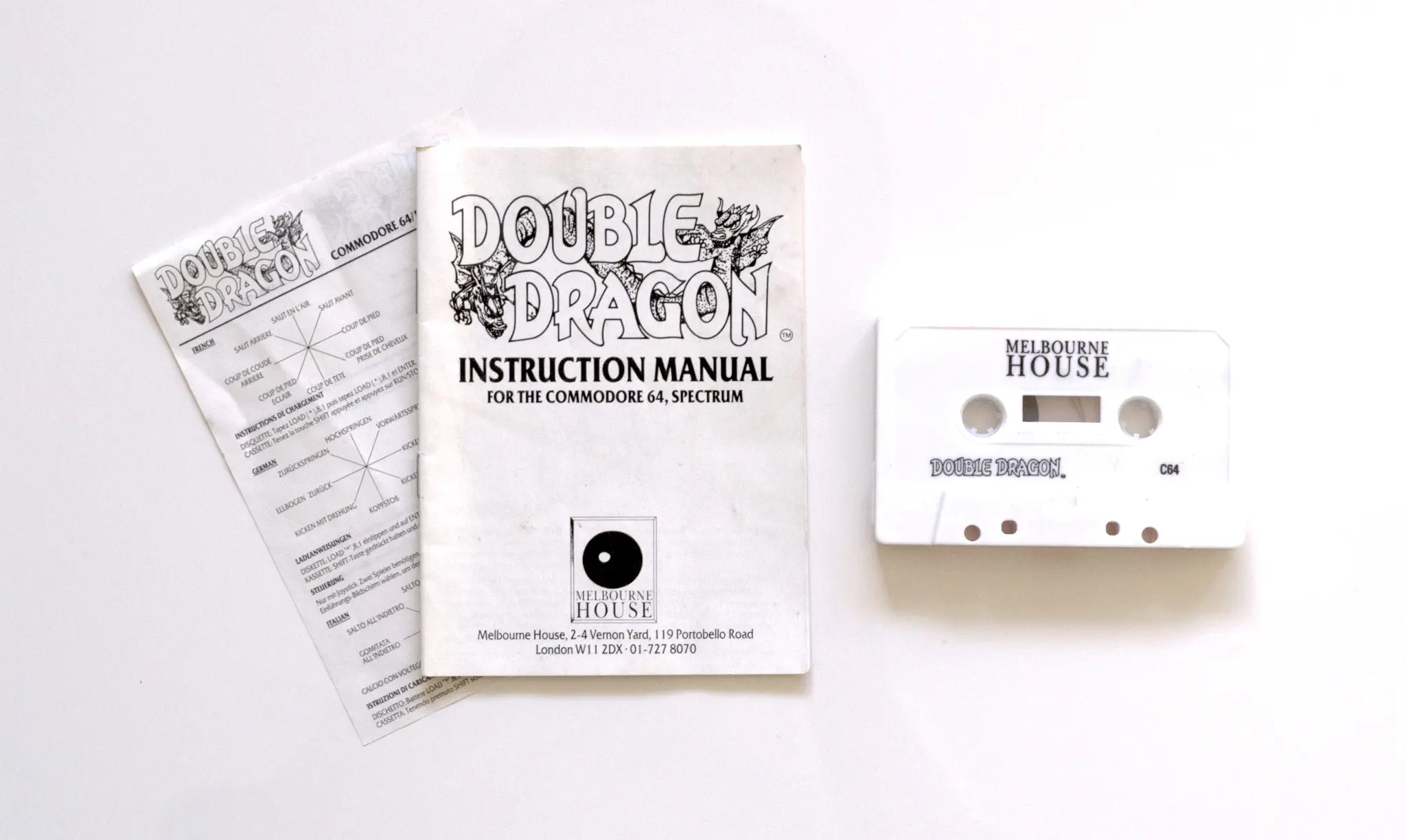 Photo of the content of Double Dragon (1988, C64, UK); developed by Technos Japan Corp., published by Melbourne House; Hi-res 3D box available at https://bigboxcollection.com