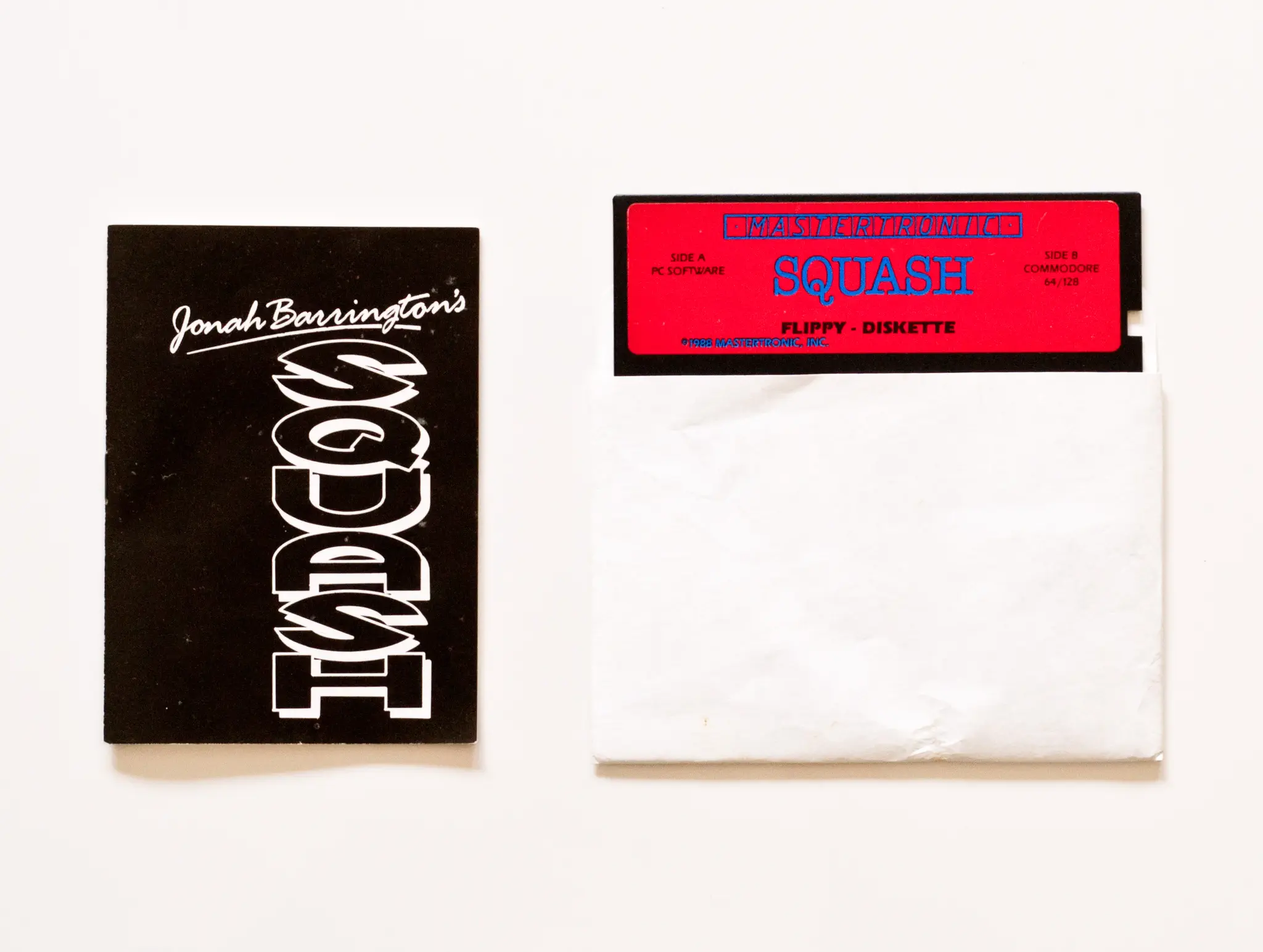 Photo of the content of Jonah Barrington's Squash (1988, C64/PC, US) Photo of the content of Jonah Barrington's Squash (1988, C64/PC, US); developed by New Generation Software Ltd., published by Mastertronic, Inc.; Hi-res 3D box available at https://bigboxcollection.com