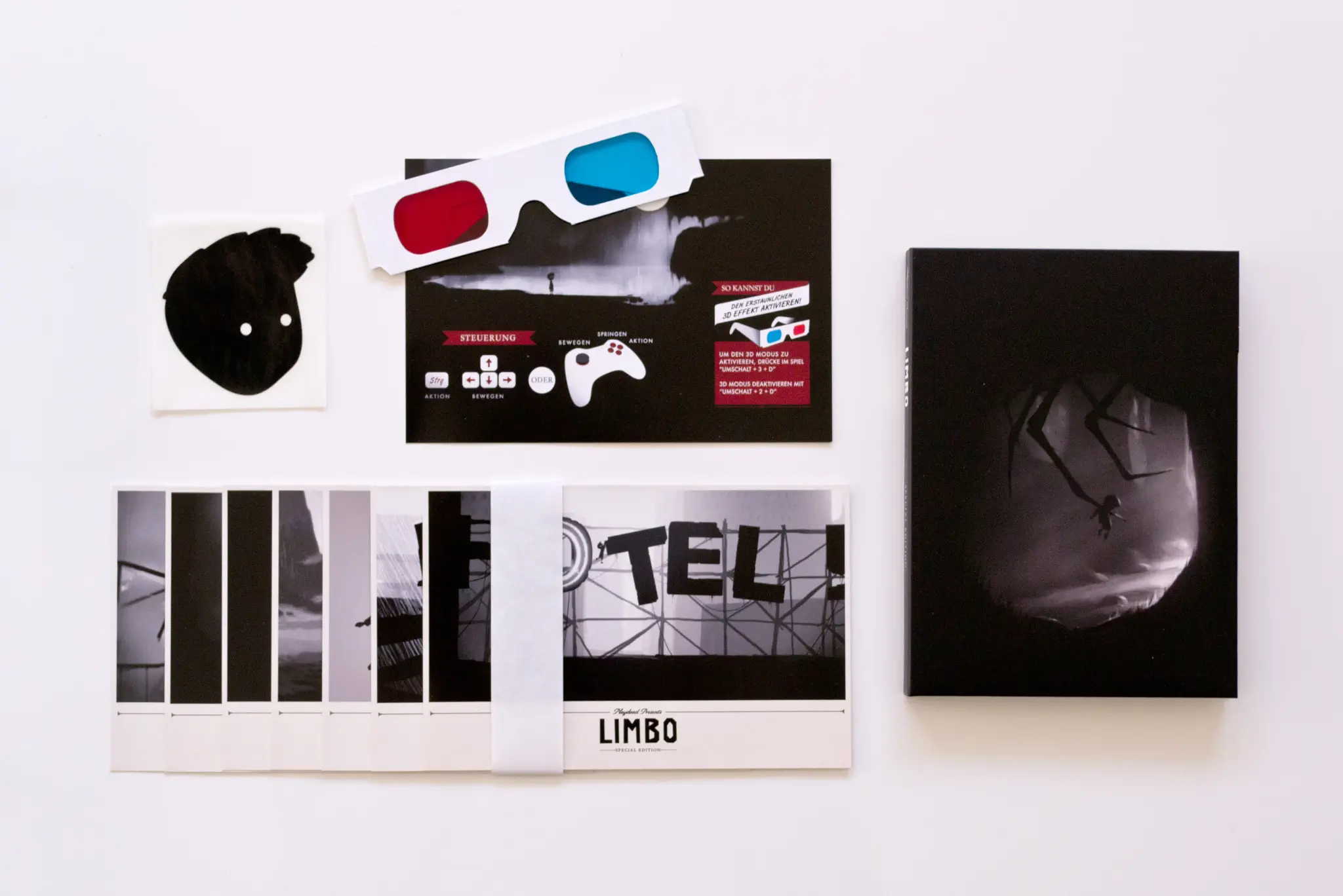 Photo of the content of Limbo (2012, PC, DE, Special Edition) Photo of the content of Limbo (2012, PC, DE, Special Edition); developed by Playdead ApS, published by Headup Games GmbH & Co. KG; Hi-res 3D box available at https://bigboxcollection.com