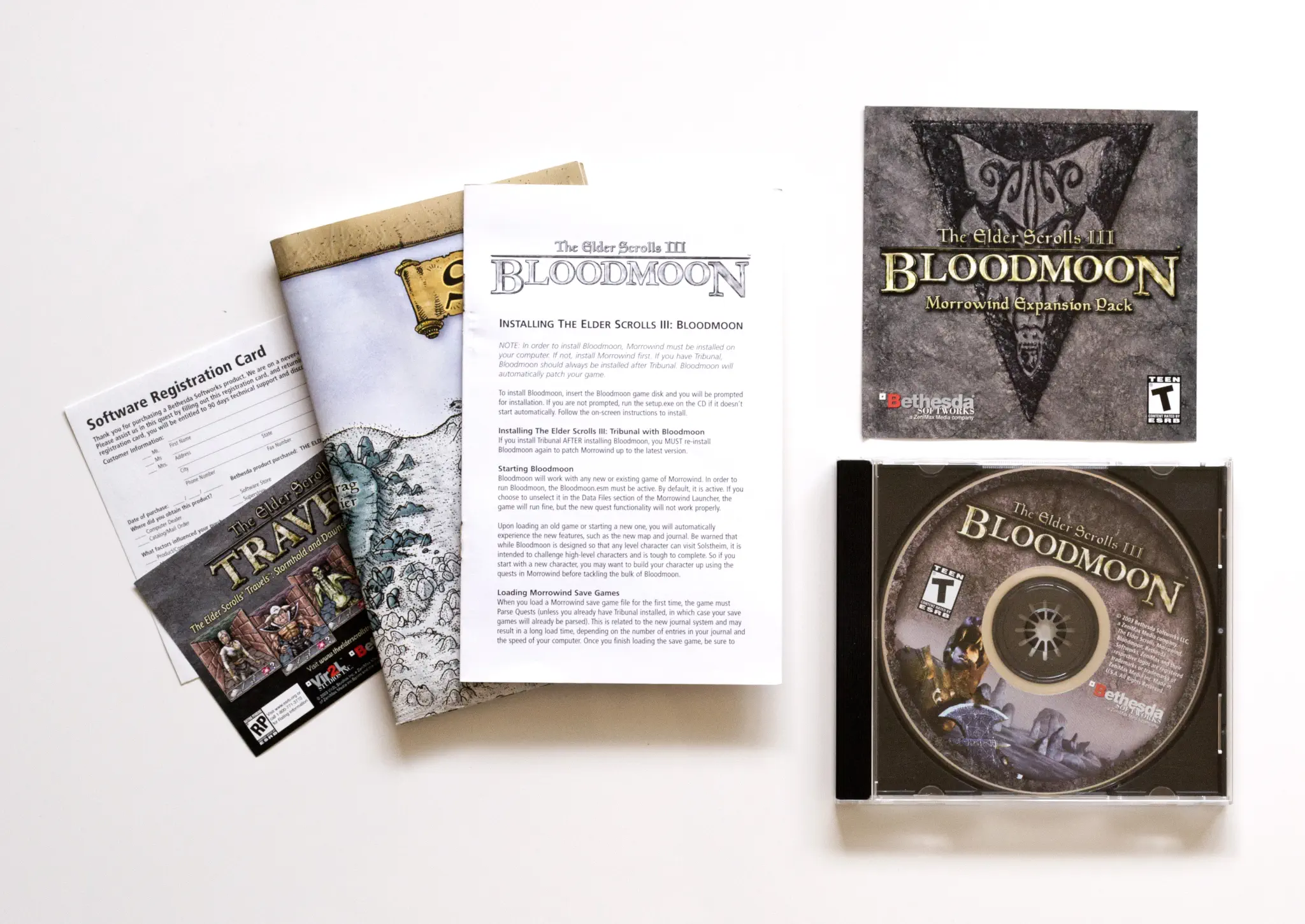 Photo of the content of The Elder Scrolls III: Bloodmoon (2003, PC, US) Photo of the content of The Elder Scrolls III: Bloodmoon (2003, PC, US); developed by Bethesda Game Studios, published by Bethesda Softworks LLC; Hi-res 3D box available at https://bigboxcollection.com
