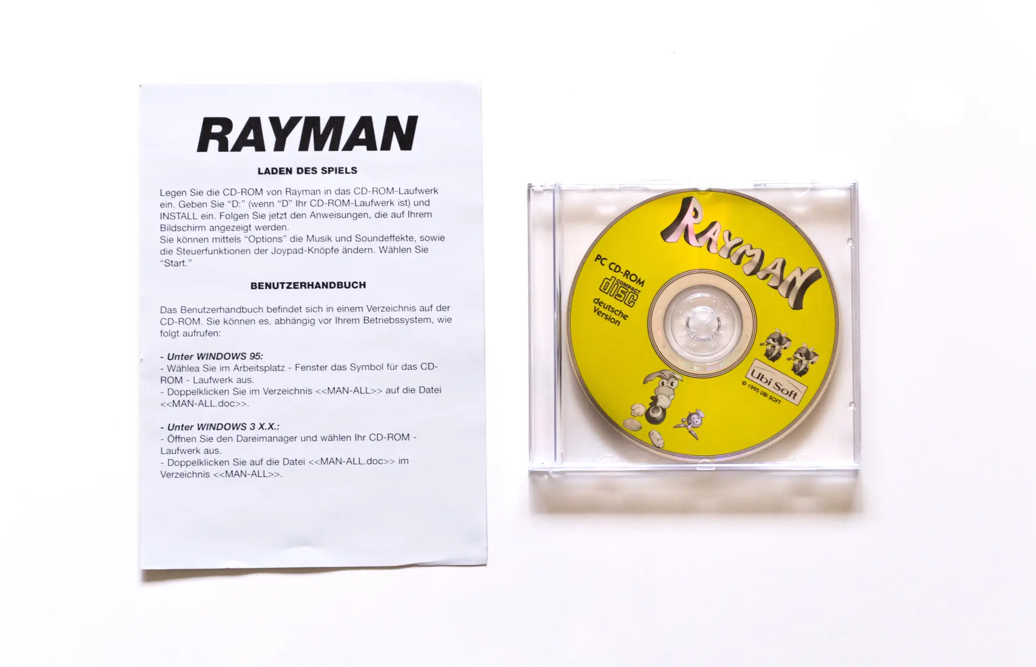 Photo of the content of Rayman (1995, PC, DE); developed by Ubi Soft Paris Studios, published by Ubi Soft Entertainment Software; Hi-res 3D box available at https://bigboxcollection.com