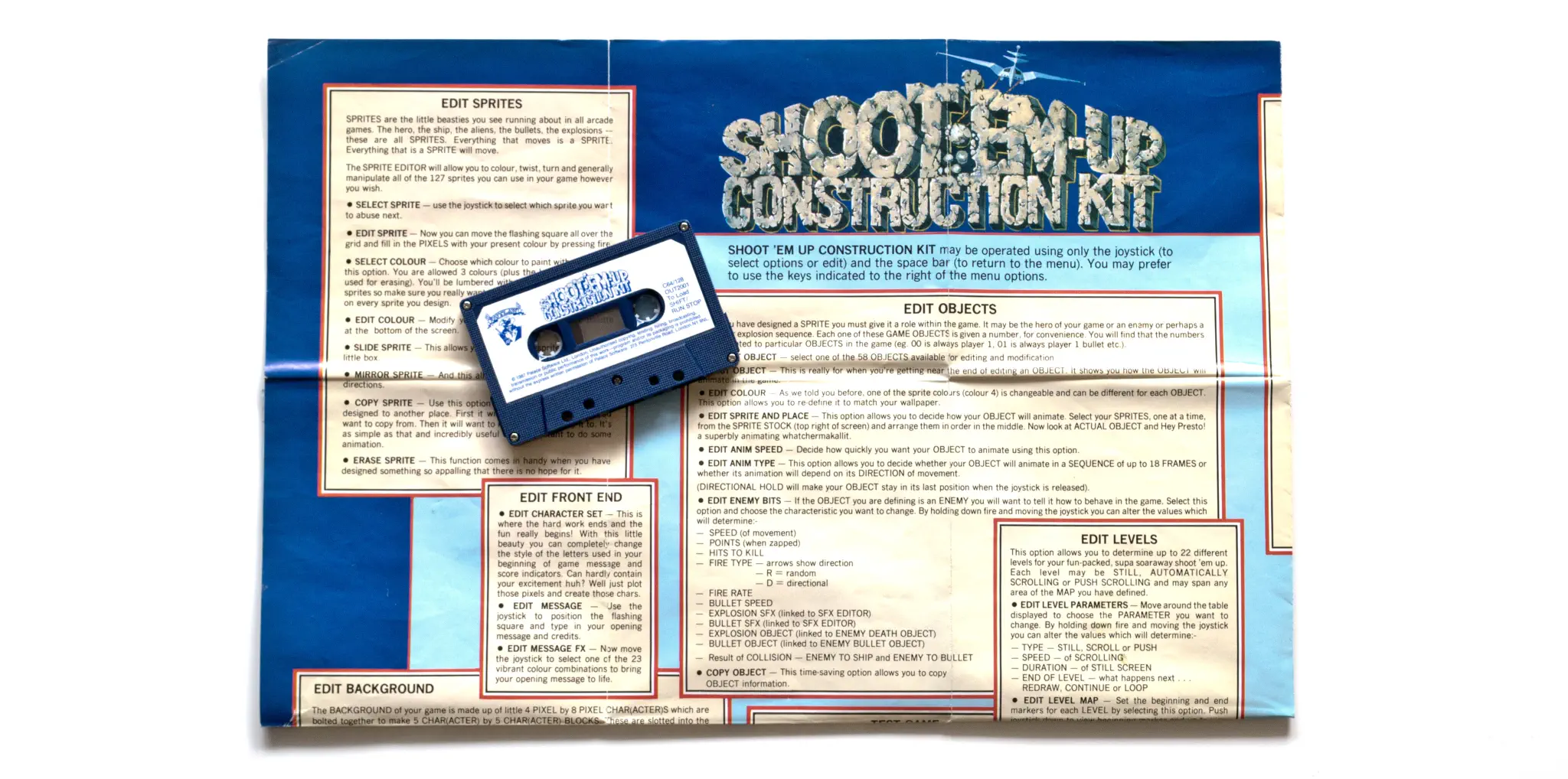 Photo of the content of Shoot'Em Up Construction Kit (1988, C64, UK); developed by Sensible Software, published by Outlaw; Hi-res 3D box available at https://bigboxcollection.com