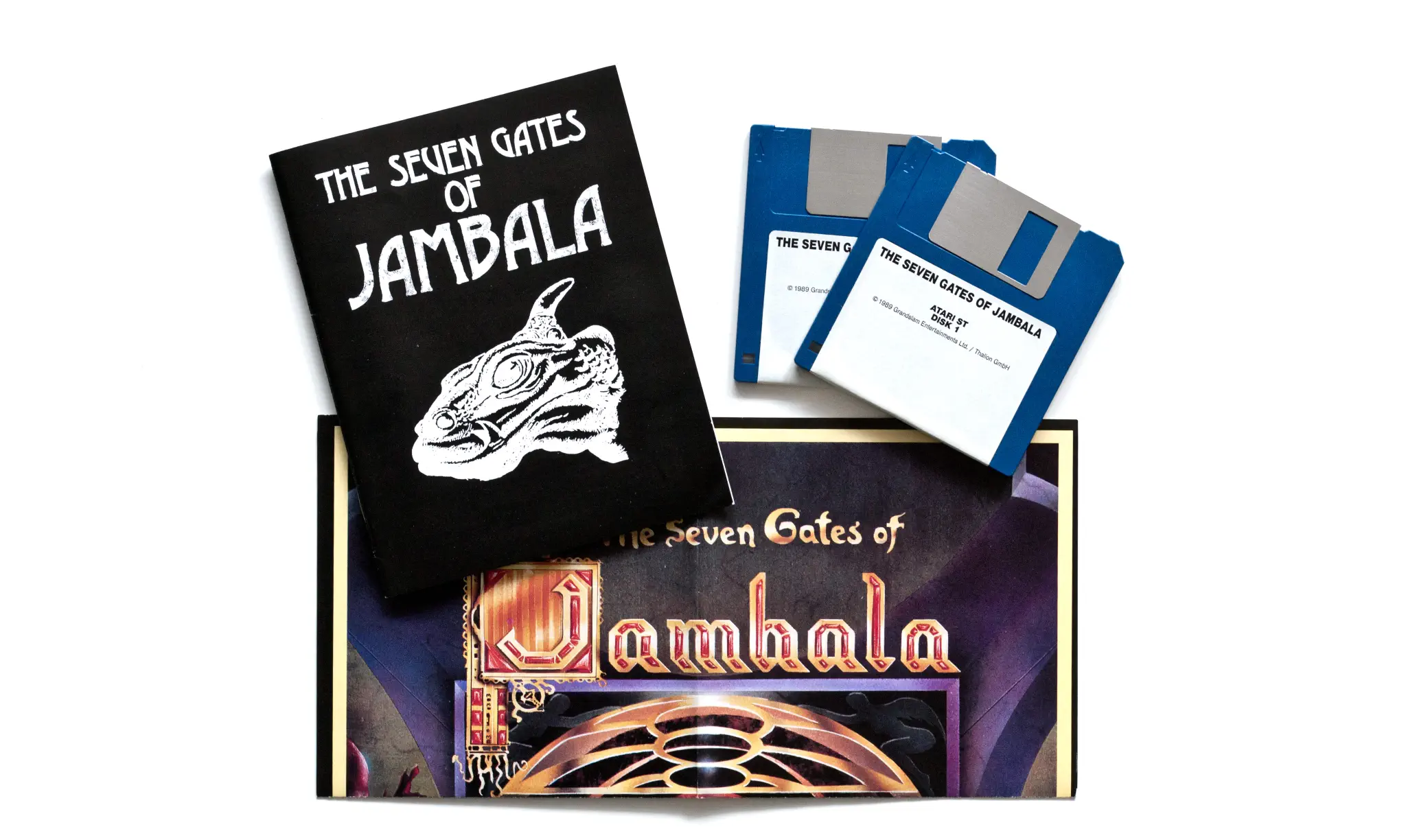 Photo of the content of The Seven Gates of Jambala (1989, Atari ST, DE) Photo of the content of The Seven Gates of Jambala (1989, Atari ST, DE); developed by Thalion Software GmbH, published by Grandslam Entertainments Ltd.; Hi-res 3D box available at https://bigboxcollection.com