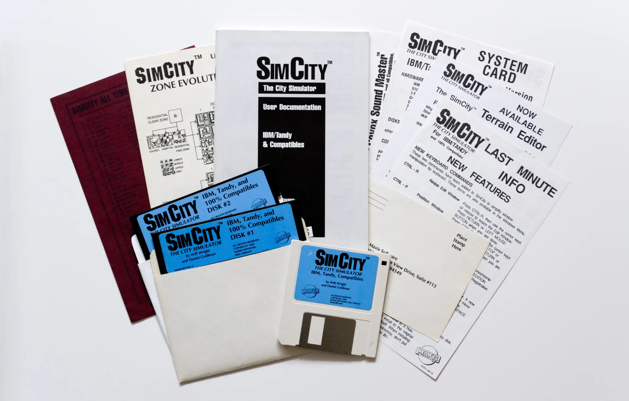 Photo of the content of SimCity (1989, PC, US); developed by Maxis Software Inc., published by Broderbund Software, Inc.; Hi-res 3D box available at https://bigboxcollection.com