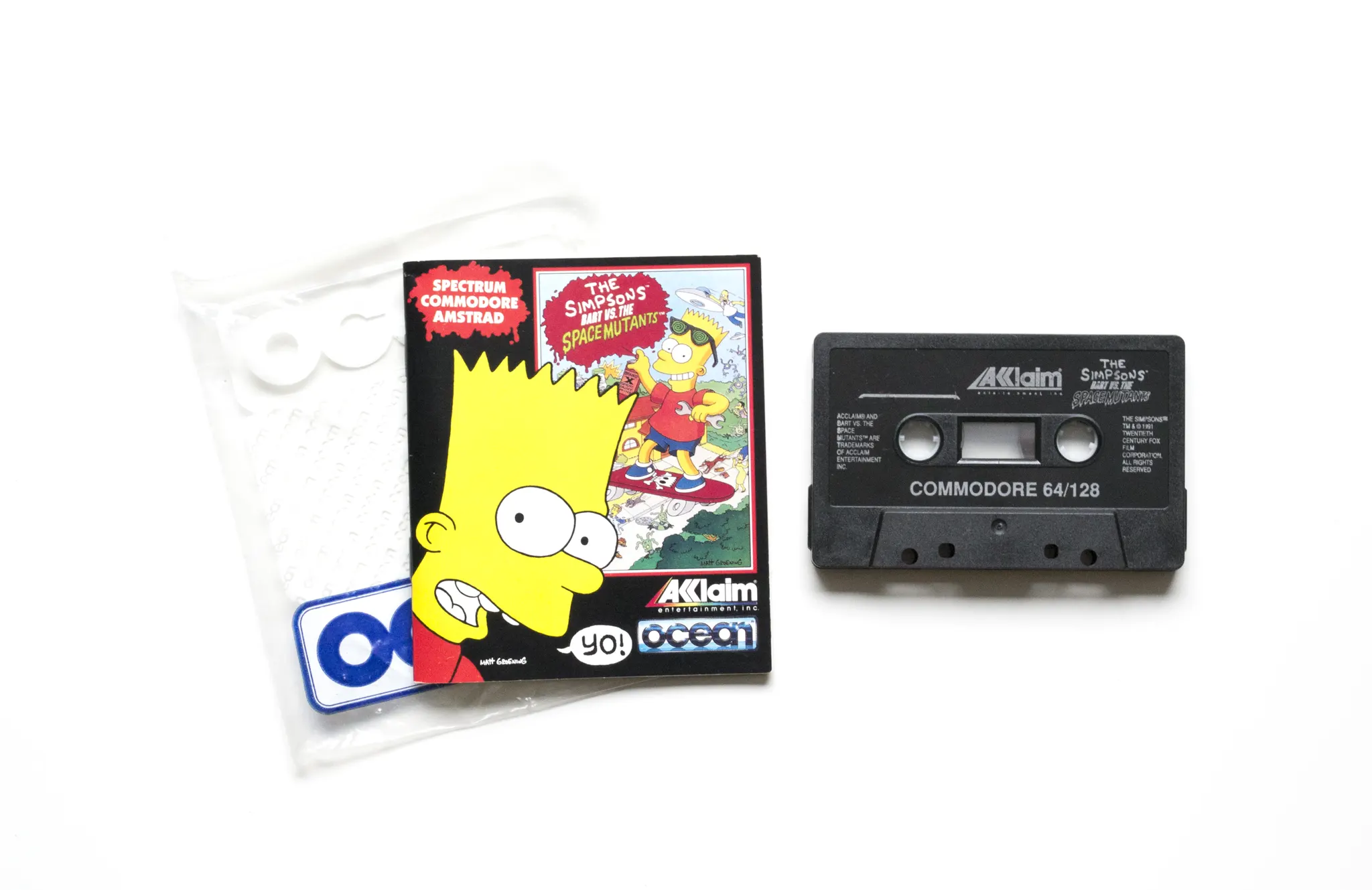 Photo of the content of The Simpsons: Bart vs. the Space Mutants (1991, C64, EU); developed by Imagineering Inc., published by Acclaim Entertainment, Inc.; Ocean Software Ltd.; Hi-res 3D box available at https://bigboxcollection.com
