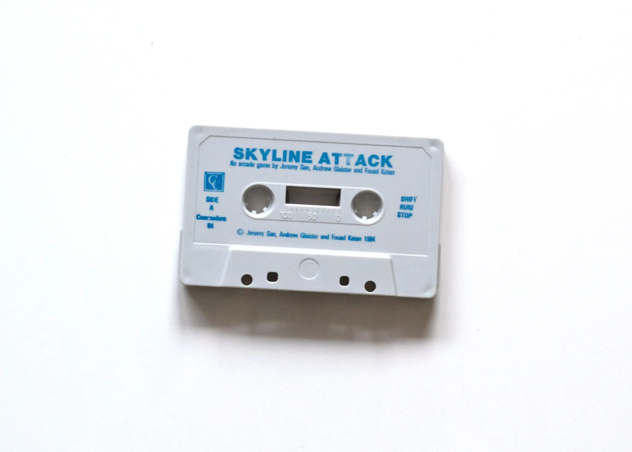 Photo of the content of Skyline Attack (1984, C64, UK) Photo of the content of Skyline Attack (1984, C64, UK); developed by Jeremy San; Andrew Glaister; Fouad Katan, published by Century Software; Hi-res 3D box available at https://bigboxcollection.com