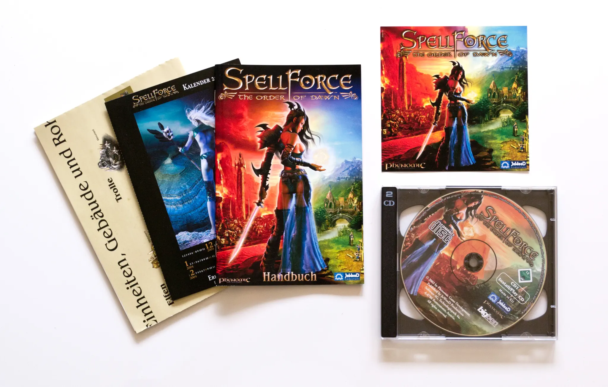 Photo of the content of SpellForce: The Order of Dawn (2003, PC, DE) Photo of the content of SpellForce: The Order of Dawn (2003, PC, DE); developed by Phenomic Game Development, published by JoWooD Productions Software AG; Hi-res 3D box available at https://bigboxcollection.com
