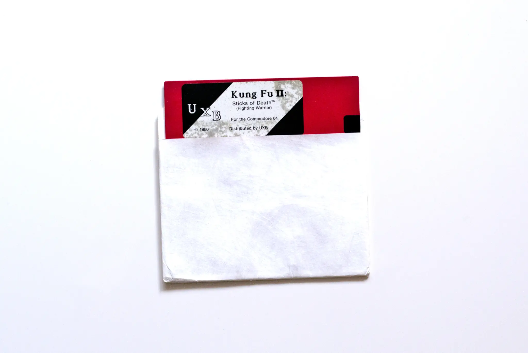 Photo of the content of Kung Fu II: Sticks of Death (1986, C64, US); developed by Studio B Ltd., published by UXB; Hi-res 3D box available at https://bigboxcollection.com