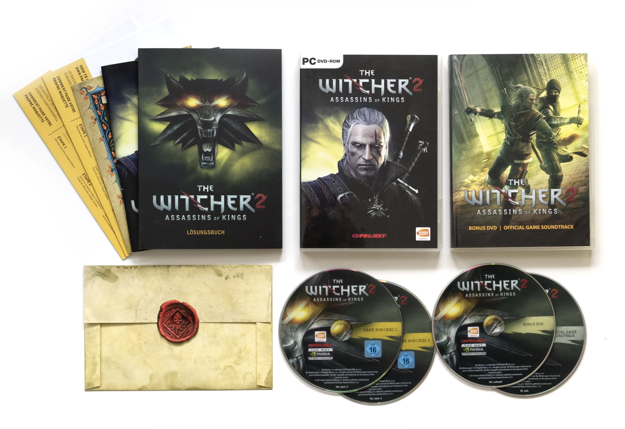 Photo of the content of The Witcher 2 (2011, PC, DE); developed by CD Projekt RED Sp. z o.o., published by CD Projekt Sp. z o.o.; Hi-res 3D box available at https://bigboxcollection.com