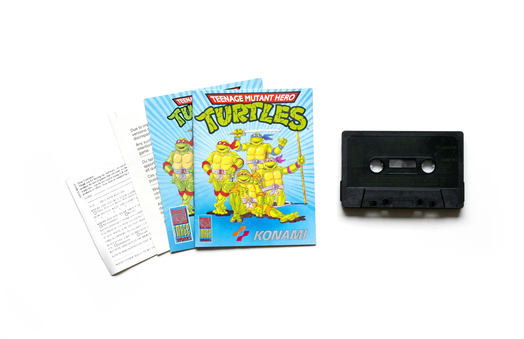 Photo of the content of Teenage Mutant Heroe Turtles (1990, C64, UK); developed by Konami Industry Co. Ltd., published by Image Works; Hi-res 3D box available at https://bigboxcollection.com