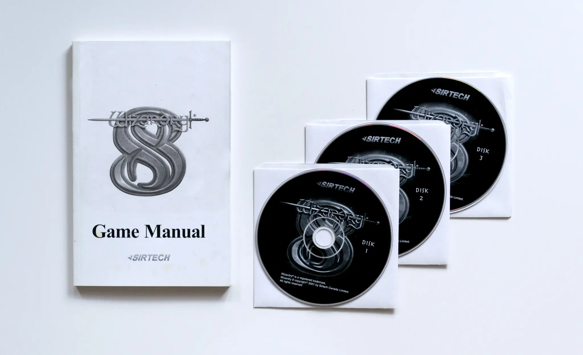 Photo of the content of Wizardry 8 (2001, PC, US); developed by Sirtech Canada Ltd., published by Sirtech Canada Ltd.; Hi-res 3D box available at https://bigboxcollection.com