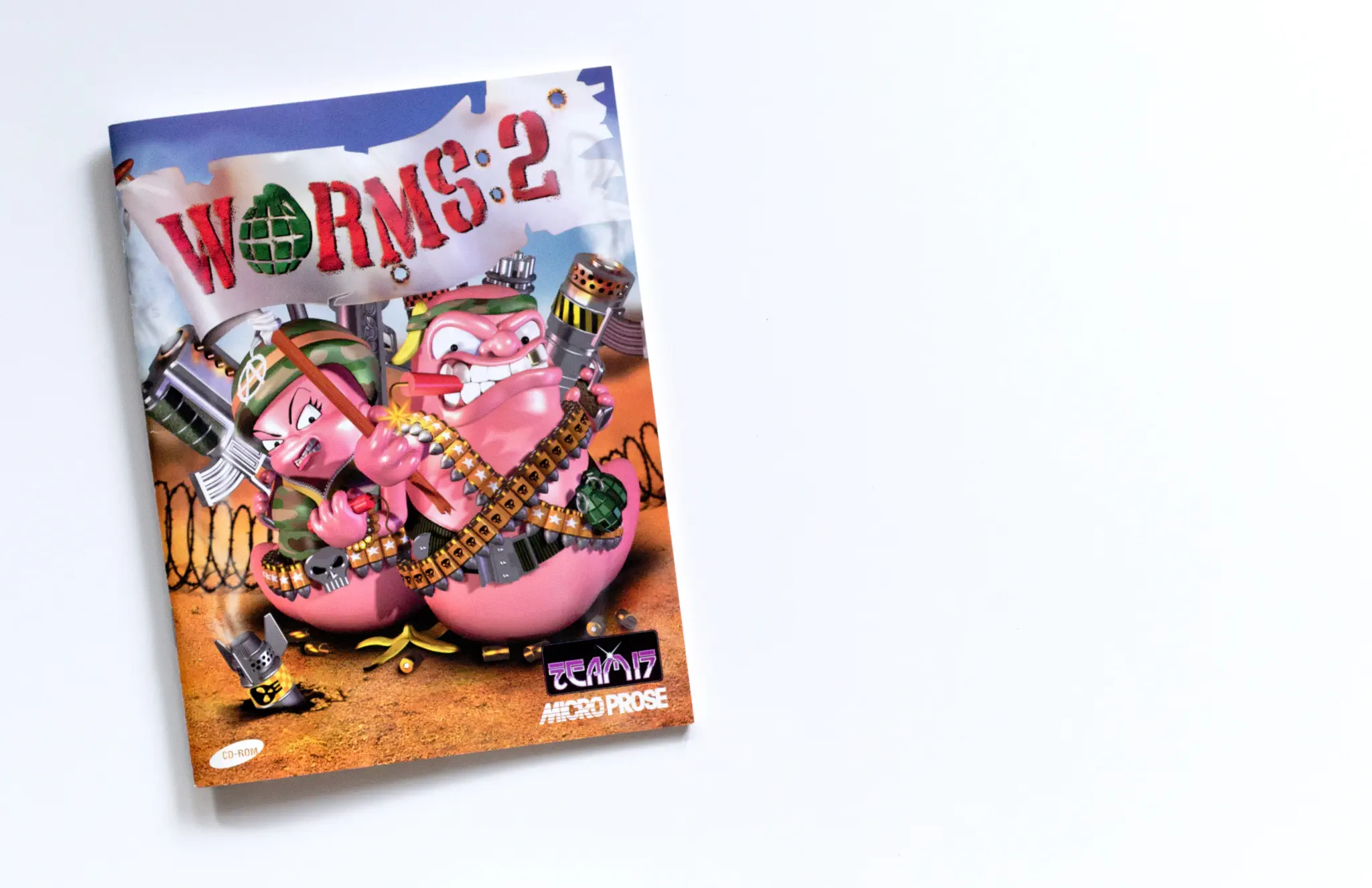 Photo of the content of Worms 2 (1997, PC, DE) Photo of the content of Worms 2 (1997, PC, DE); developed by Team17 Software Limited, published by MicroProse Software, Inc.; Hi-res 3D box available at https://bigboxcollection.com