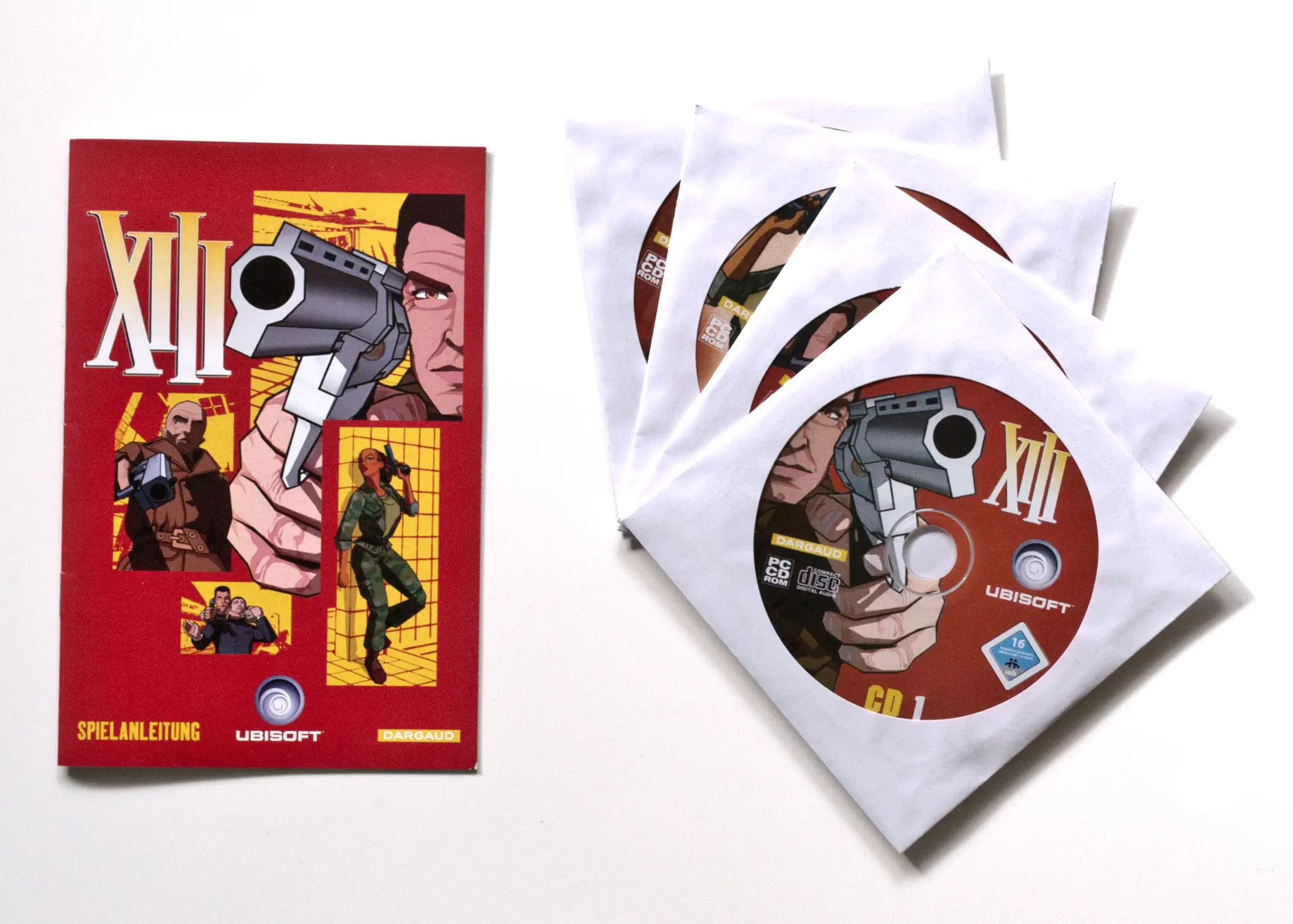 Photo of the content of XIII (2003, PC, DE); developed by Ubisoft Paris Studios SARL, published by Ubisoft Entertainment SA; Hi-res 3D box available at https://bigboxcollection.com