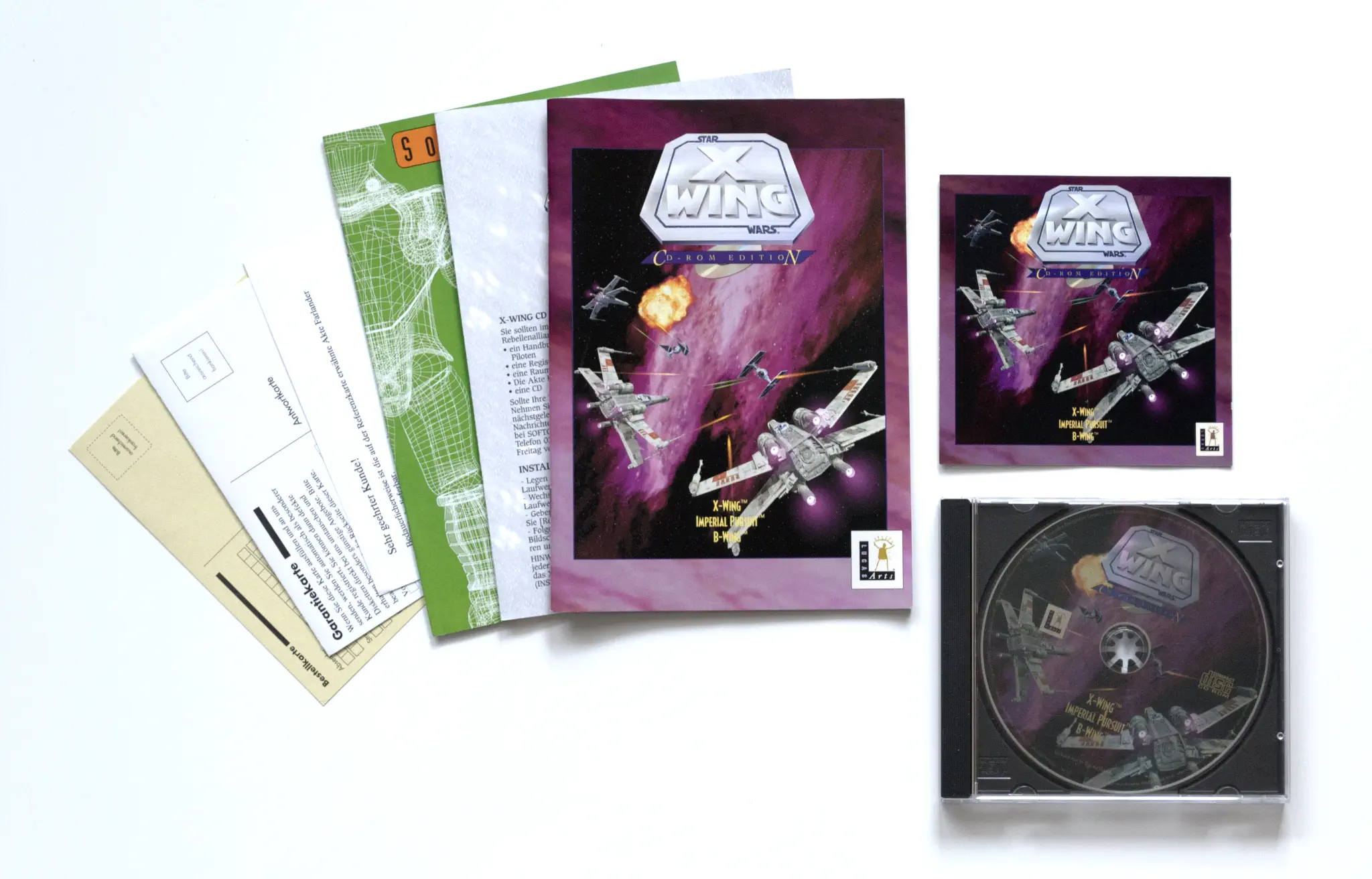Photo of the content of Star Wars: X-Wing (1994, PC, DE, Collector's CD-ROM) Photo of the content of Star Wars: X-Wing (1994, PC, DE, Collector's CD-ROM); developed by LucasArts Entertainment Company LLC, published by Softgold Computerspiele GmbH; Hi-res 3D box available at https://bigboxcollection.com