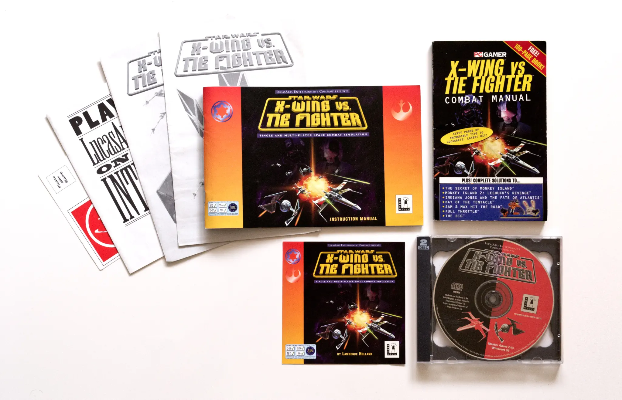 Photo of the content of Star Wars: X-Wing vs. Tie Fighter (1997, PC, EU) Photo of the content of Star Wars: X-Wing vs. Tie Fighter (1997, PC, EU); developed by Totally Games, Inc., published by LucasArts Entertainment Company LLC; Hi-res 3D box available at https://bigboxcollection.com